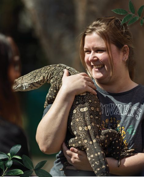 student holding a lizard