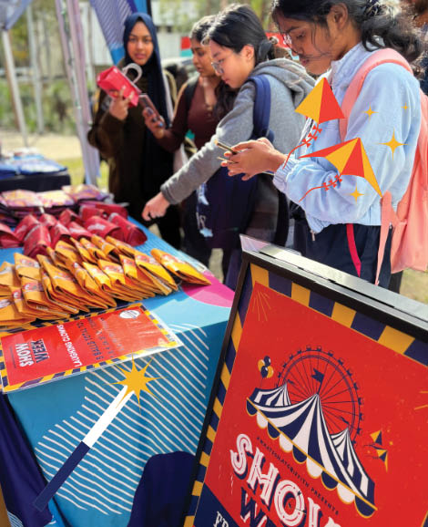 Students lining up for a show bag