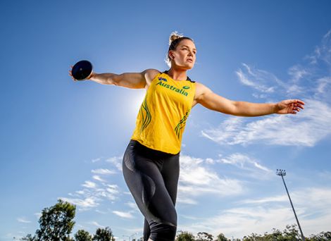 Female athlete throwing a disc