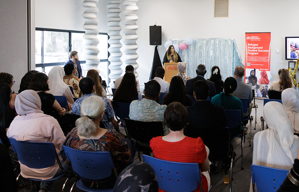 A student presenting at a large event