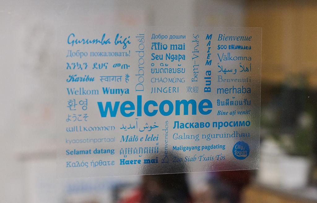 A photo of a sticker with the word welcome in dozens of languages
