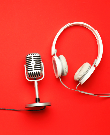 microphone and headphones on red background