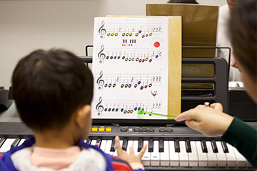 Child playing keyboard