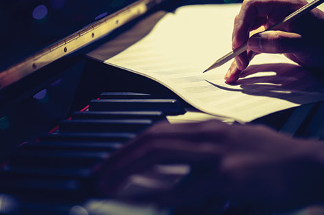 Student composing at the piano