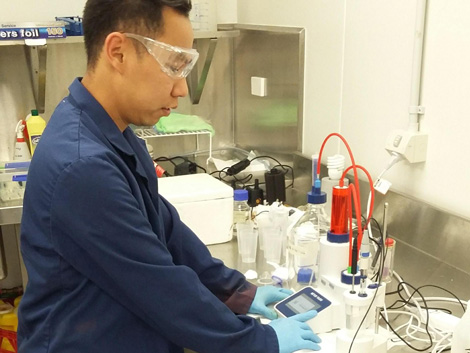 a scientist using a titrator