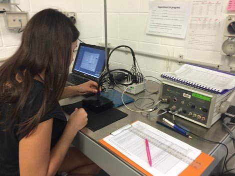 Scientist using pulse-amplitude modulation and recording data