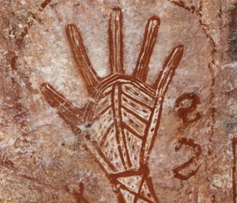  image of rock art: a hand painted in ochre with decorate line infill