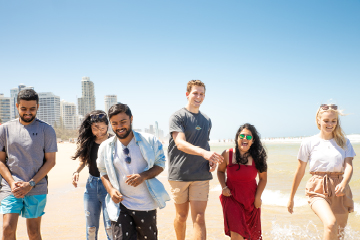 People walking along the beach