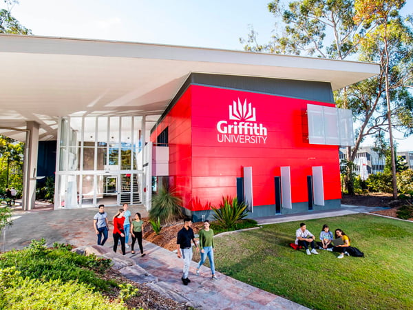 A Griffith University building with students walking on the path outside
