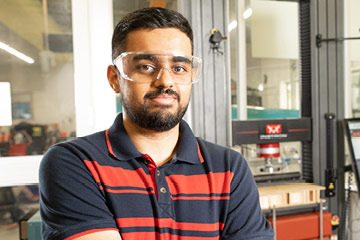 Student wearing safety goggles in a lab