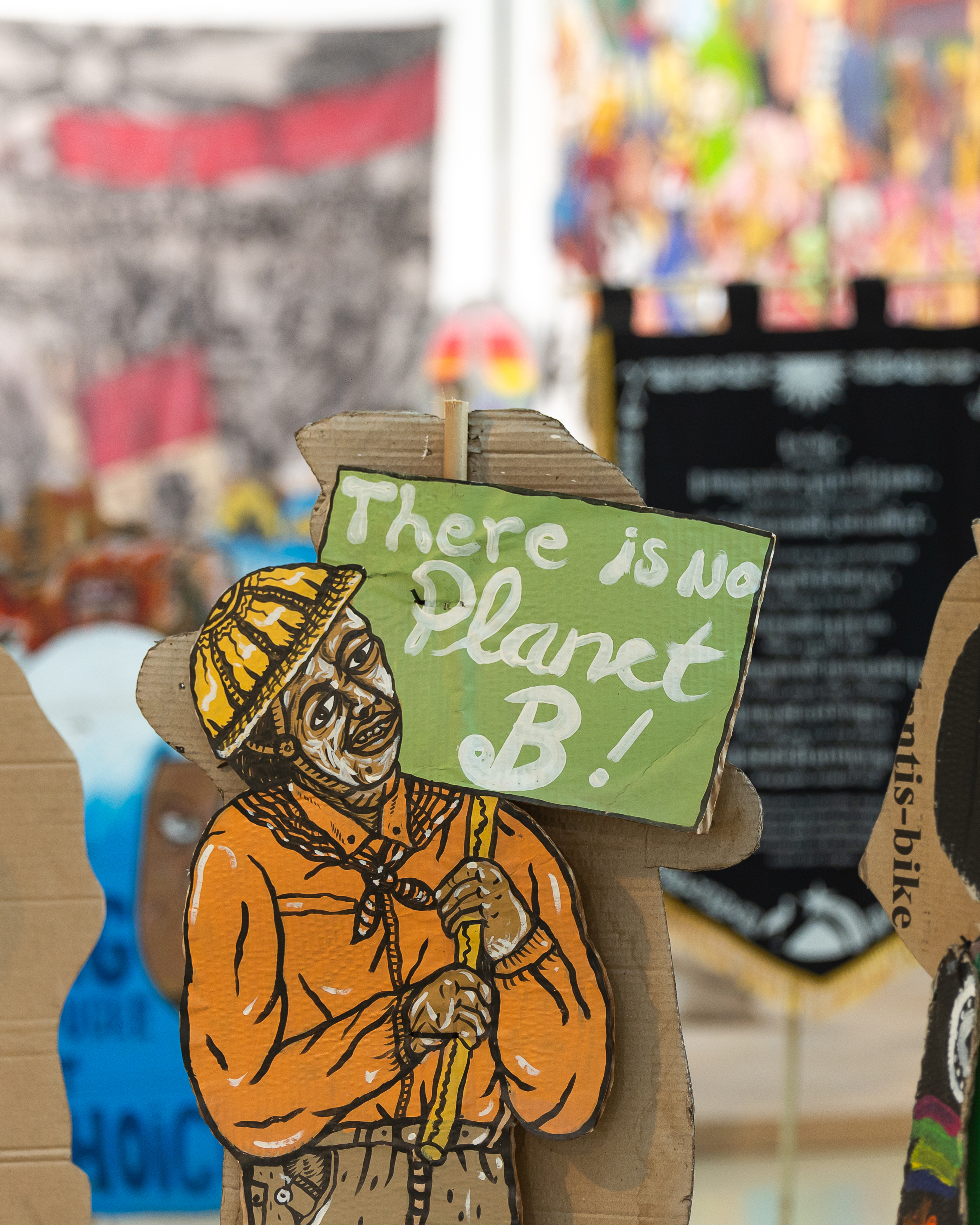 A puppet created by Taring Padi with text reading' There is no Planet B!