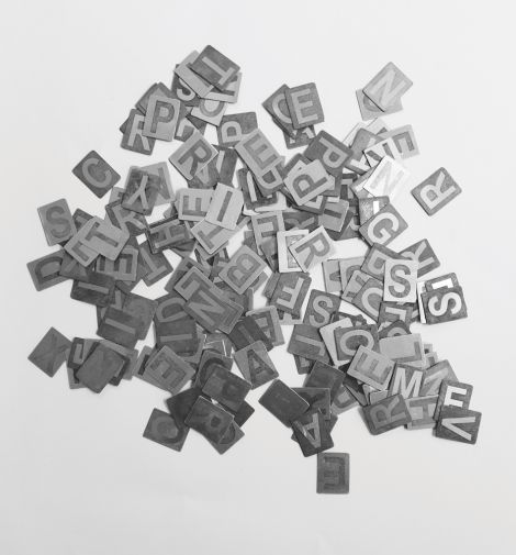 Michelle Wild, “UN:INVITED”, 2020, Etched aluminium, 4 x 3 cm (individual size)