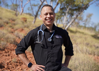 a doctor standing in the Australian outback
