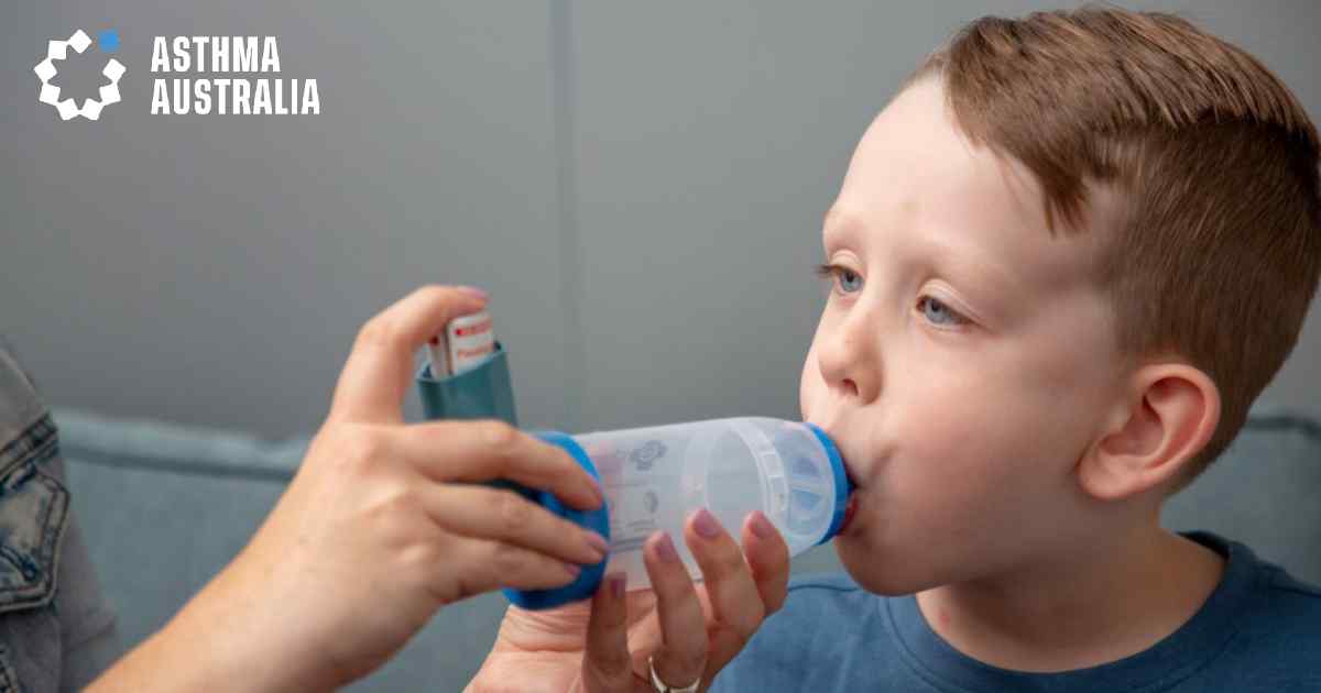 A child being administered an asthma inhaler