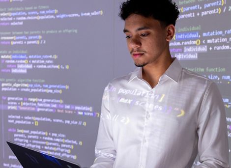 Male student with data displayed behind him