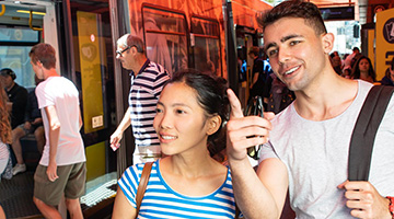 Students at a Gold Coast tram stop