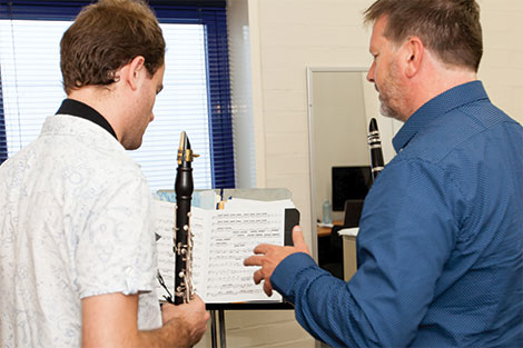 Paul dean teaching a clarinet student