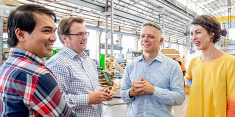 Group of people chatting in a warehouse