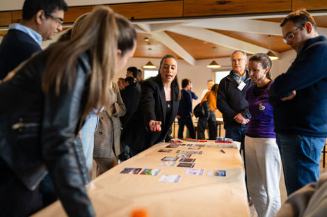 People standing at a table talking