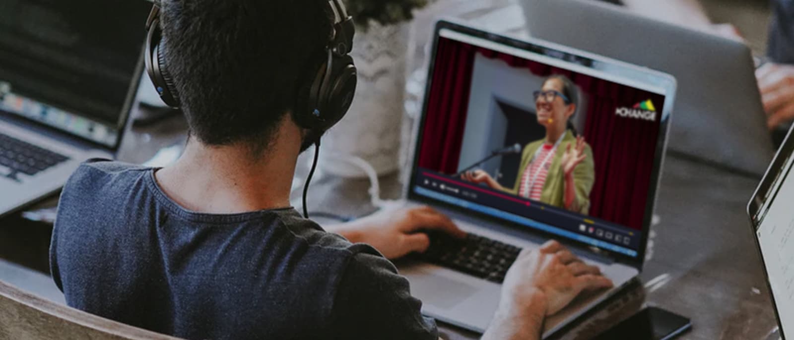 A person watching the conference live stream on their laptop