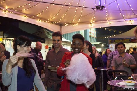 Students enjoying food at a night event