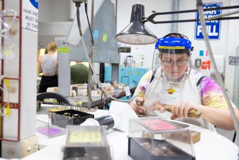 A student works on a jewellery piece in the QCA jewellery studios