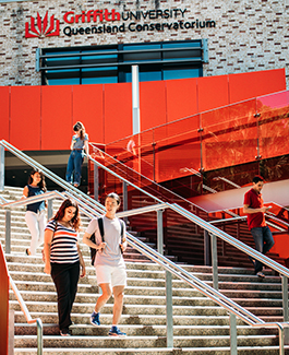 Students walking down the stairs of the Queensland Conservatorium in South Bank