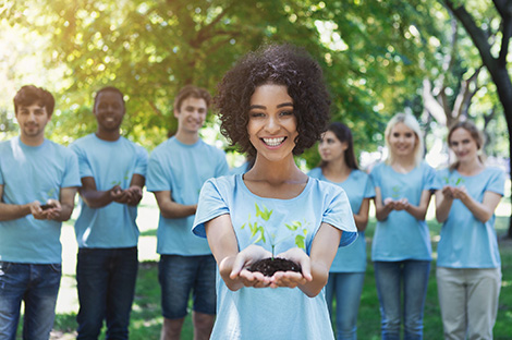 woman holding a plant