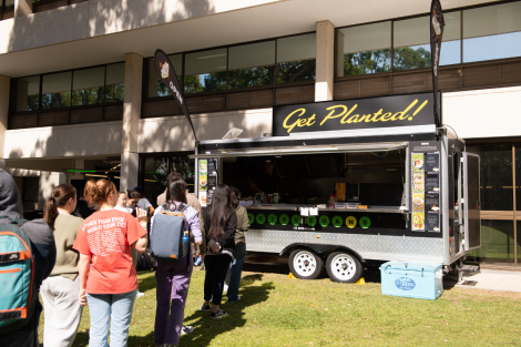 students lining up for food truck