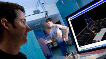 Research in a lab with a runner connected to a computer