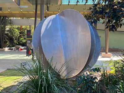 a steel sculpture on the lawn