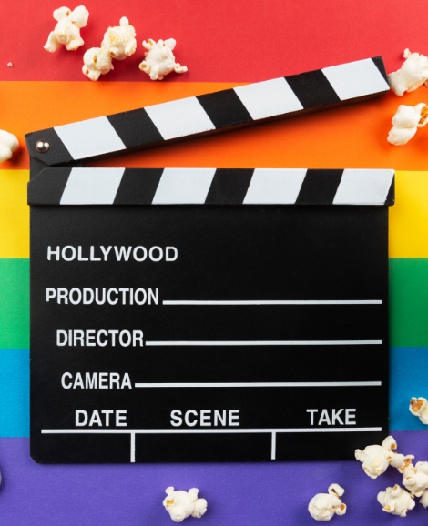 Pride coloured background with film marker and popcorn scattered