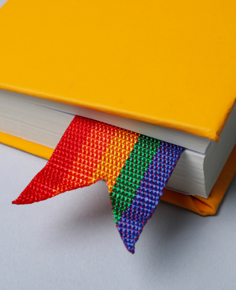 yellow book with rainbow bookmark