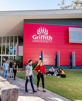 Professional photograph of the red exterior of G34 The Chancellory building at Griffith University Gold Coast campus.
