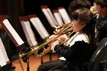 Young person playing trumpet