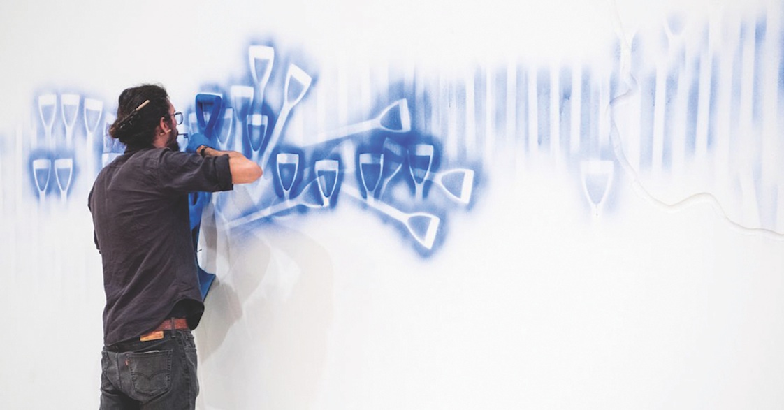 Image: Dale Harding installing Wall Composition in Reckitt&rsquo;s Blue 2017 / Commissioned 2017 with funds from anonymous donors through the Queensland Art Gallery | Gallery of Modern Art Foundation / Australian Art Collection, Queensland Art Gallery, 2017/ Photographs: Chloë Callistemon, QAGOMA