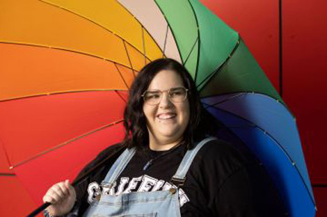 Griffith student with rainbow umbrella