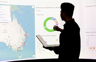 student looking at data on a whiteboard