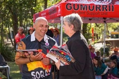 Two Griffith Gumurrii Student Supporters interacting with each other outdoor