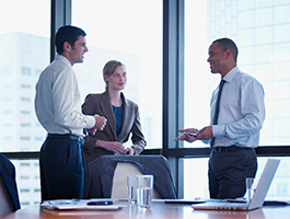 Business men and woman chatting in an office