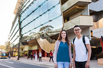 Students standing in front of a building