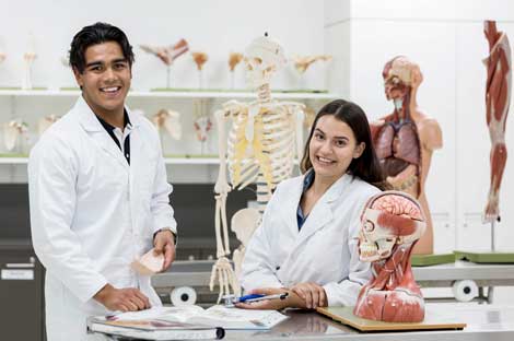 A man and a woman in an anatomy lab