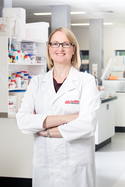 Professor Katherine Andrews in lab coat 