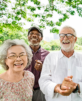 an elderly woman with two elderly men