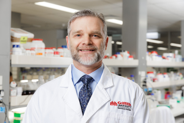 Associate Professor Rohan Davis in lab coat