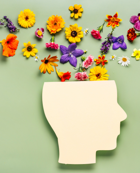 paper head with flowers sprinkling out