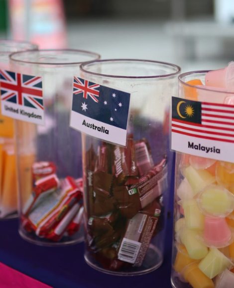 Lollies from different countries in glass containers