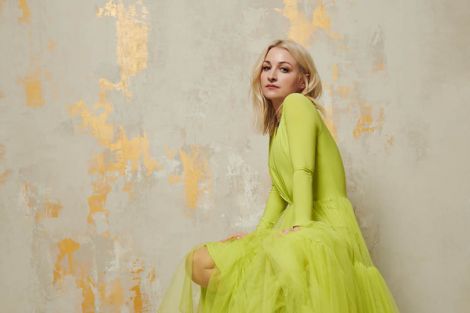 Kate Miller-Heidke wearing an apple green dress
