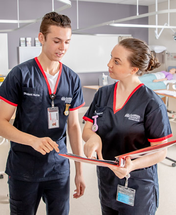 Male and female student nurse in a hospital setting